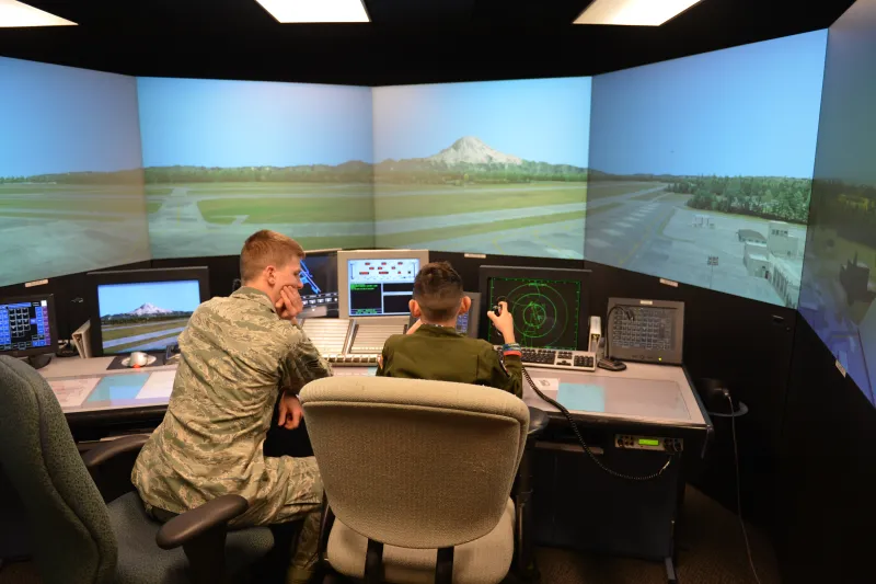 SSgt Logan Williams teaching aircraft communication procedures in the ATC simulator at McChord AFB